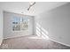 Cozy bedroom with plush carpet, a large window, and modern track lighting at 10034 Evening Sun Ct, Avon, IN 46123