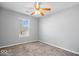 Bright bedroom with a ceiling fan and a large window allowing natural light at 10034 Evening Sun Ct, Avon, IN 46123