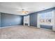 Large bedroom with neutral carpet and two windows, offering ample natural light at 10034 Evening Sun Ct, Avon, IN 46123