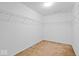 Walk-in closet with carpet and wire shelving; organized storage solution at 10034 Evening Sun Ct, Avon, IN 46123