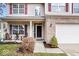 Charming two-story home with a well-maintained front yard and cozy porch seating at 10034 Evening Sun Ct, Avon, IN 46123