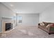 Comfortable living room features a fireplace, neutral walls, and a cozy couch at 10034 Evening Sun Ct, Avon, IN 46123