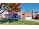 Stunning two-story red brick home with attached garage, lush lawn, and vibrant fall foliage at 1160 Mt Vernon Dr, Greenwood, IN 46142