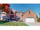 Beautiful two-story brick home featuring a well-manicured lawn and attached two car garage at 1160 Mt Vernon Dr, Greenwood, IN 46142