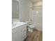 Clean bathroom with white vanity and tub shower combo at 2331 Saddle Dr, Shelbyville, IN 46176