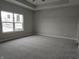 Spacious bedroom with gray carpeting and large window at 2331 Saddle Dr, Shelbyville, IN 46176