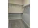 Walk-in closet with ample shelving and hanging rods at 2331 Saddle Dr, Shelbyville, IN 46176