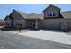 Charming brick home features a covered porch and two-car garage, new construction ready for its new owner at 2331 Saddle Dr, Shelbyville, IN 46176