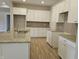 Spacious kitchen with white cabinets, granite countertops, and hardwood floors at 2331 Saddle Dr, Shelbyville, IN 46176