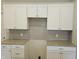 White shaker-style kitchen cabinets with granite countertops at 2331 Saddle Dr, Shelbyville, IN 46176