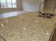 Granite kitchen countertop with double sink and under-cabinet lighting at 2331 Saddle Dr, Shelbyville, IN 46176