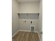 Laundry room with vinyl flooring and built-in shelving at 2331 Saddle Dr, Shelbyville, IN 46176