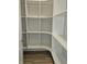 Walk-in pantry with ample shelving and hardwood floors at 2331 Saddle Dr, Shelbyville, IN 46176