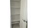 Open pantry with white shelving and gray tile floor at 2331 Saddle Dr, Shelbyville, IN 46176