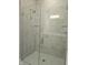 Modern frameless glass shower with gray tile surround at 2331 Saddle Dr, Shelbyville, IN 46176