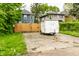 A spacious driveway secured by a wooden fence, offering ample parking at 3047 N New Jersey St, Indianapolis, IN 46205