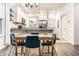Bright kitchen and dining area with modern lighting and stainless steel appliances at 3047 N New Jersey St, Indianapolis, IN 46205