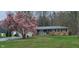Charming brick home with a beautifully blooming magnolia tree in the front yard at 8190 Beech Grove Rd, Martinsville, IN 46151