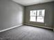 Simple bedroom with grey walls and carpet at 2327 Saddle Dr, Shelbyville, IN 46176