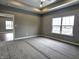 Spacious bedroom with carpeted floor and large window at 2327 Saddle Dr, Shelbyville, IN 46176