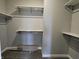 Walk-in closet with shelves and hanging rods at 2327 Saddle Dr, Shelbyville, IN 46176