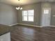 Bright dining area with hardwood floors and chandelier at 2327 Saddle Dr, Shelbyville, IN 46176