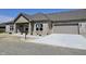 Charming single-story brick home with a two-car garage and concrete driveway at 2327 Saddle Dr, Shelbyville, IN 46176
