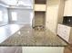 Kitchen island with granite countertop and double sink at 2327 Saddle Dr, Shelbyville, IN 46176