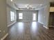 Spacious living room with hardwood floors and access to backyard at 2327 Saddle Dr, Shelbyville, IN 46176