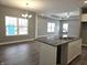 Open living room and kitchen with hardwood floors at 2327 Saddle Dr, Shelbyville, IN 46176