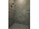 Large shower with grey tile and glass door at 2327 Saddle Dr, Shelbyville, IN 46176