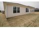 Rear exterior with covered patio and tidy backyard of a well-maintained single-Gathering home at 6112 Card Blvd, Indianapolis, IN 46221