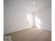 Well-lit bedroom with carpet flooring and a window at 6112 Card Blvd, Indianapolis, IN 46221