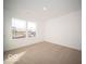 Spacious bedroom with neutral carpeting and large window at 6112 Card Blvd, Indianapolis, IN 46221