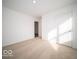 Bright bedroom featuring neutral wall paint and carpet at 6112 Card Blvd, Indianapolis, IN 46221