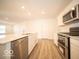 Modern kitchen featuring stainless steel appliances and a kitchen island at 6112 Card Blvd, Indianapolis, IN 46221