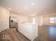 Open concept kitchen with stainless steel refrigerator and white cabinetry at 6112 Card Blvd, Indianapolis, IN 46221