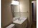 Bathroom with a single sink vanity, a mounted towel rack, and a modern lighting fixture at 8010 Philadelphia Dr, Fishers, IN 46038