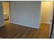Bedroom with wood flooring and view into bathroom at 8010 Philadelphia Dr, Fishers, IN 46038