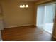 Dining room with wood flooring and vertical blinds and a sliding door at 8010 Philadelphia Dr, Fishers, IN 46038