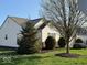 Side exterior of the house with lawn and landscaping at 8010 Philadelphia Dr, Fishers, IN 46038