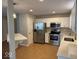 Bright kitchen featuring stainless steel appliances, white cabinets, tile flooring, and quartz countertops at 8010 Philadelphia Dr, Fishers, IN 46038