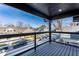 Balcony view showcasing neighborhood homes, a blue sky, and sleek metal railings at 1015 Churchman Ave, Indianapolis, IN 46203