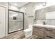 Modern bathroom with a walk-in shower, wood-look vanity, and stylish tile flooring at 1015 Churchman Ave, Indianapolis, IN 46203