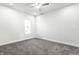 Empty bedroom with carpet, ceiling fan, and a window at 1015 Churchman Ave, Indianapolis, IN 46203