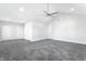 Bedroom features soft gray carpet, high ceiling, recessed lighting, and ample closet space at 1015 Churchman Ave, Indianapolis, IN 46203