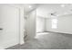 Bright bedroom boasts neutral tones, plush carpet, a ceiling fan, and natural light from a window at 1015 Churchman Ave, Indianapolis, IN 46203
