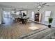 Open dining area with modern chandelier, adjacent to a kitchen with stainless steel appliances at 1015 Churchman Ave, Indianapolis, IN 46203