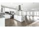 Open-concept kitchen with a large island, stainless steel appliances, and hardwood floors at 1015 Churchman Ave, Indianapolis, IN 46203
