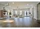 Bright, open living room with modern lighting, neutral decor, and stylish furniture arrangement at 1015 Churchman Ave, Indianapolis, IN 46203